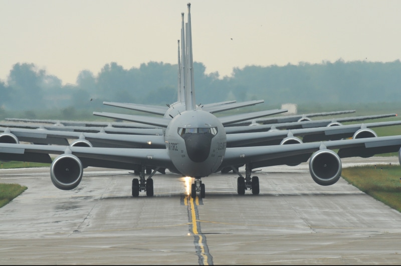 airplane, aircraft, gray, outdoors, aviation, fog, runway, military jets, nature, travel, tanker, mode of transportation, daytime, transportation, no people