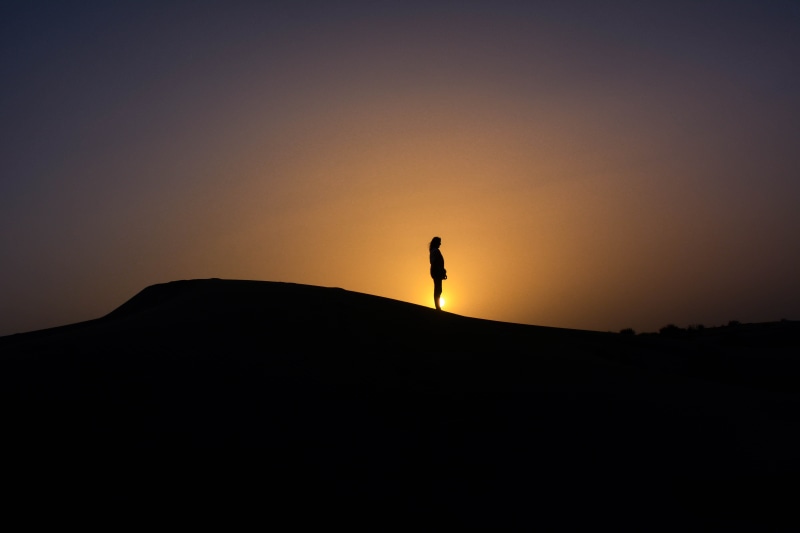 mound, sky, land, woman, tranquility, scenics - nature, leisure activity, side view, copy space, landscape, lifestyles, person, male, dune, unrecognizable person