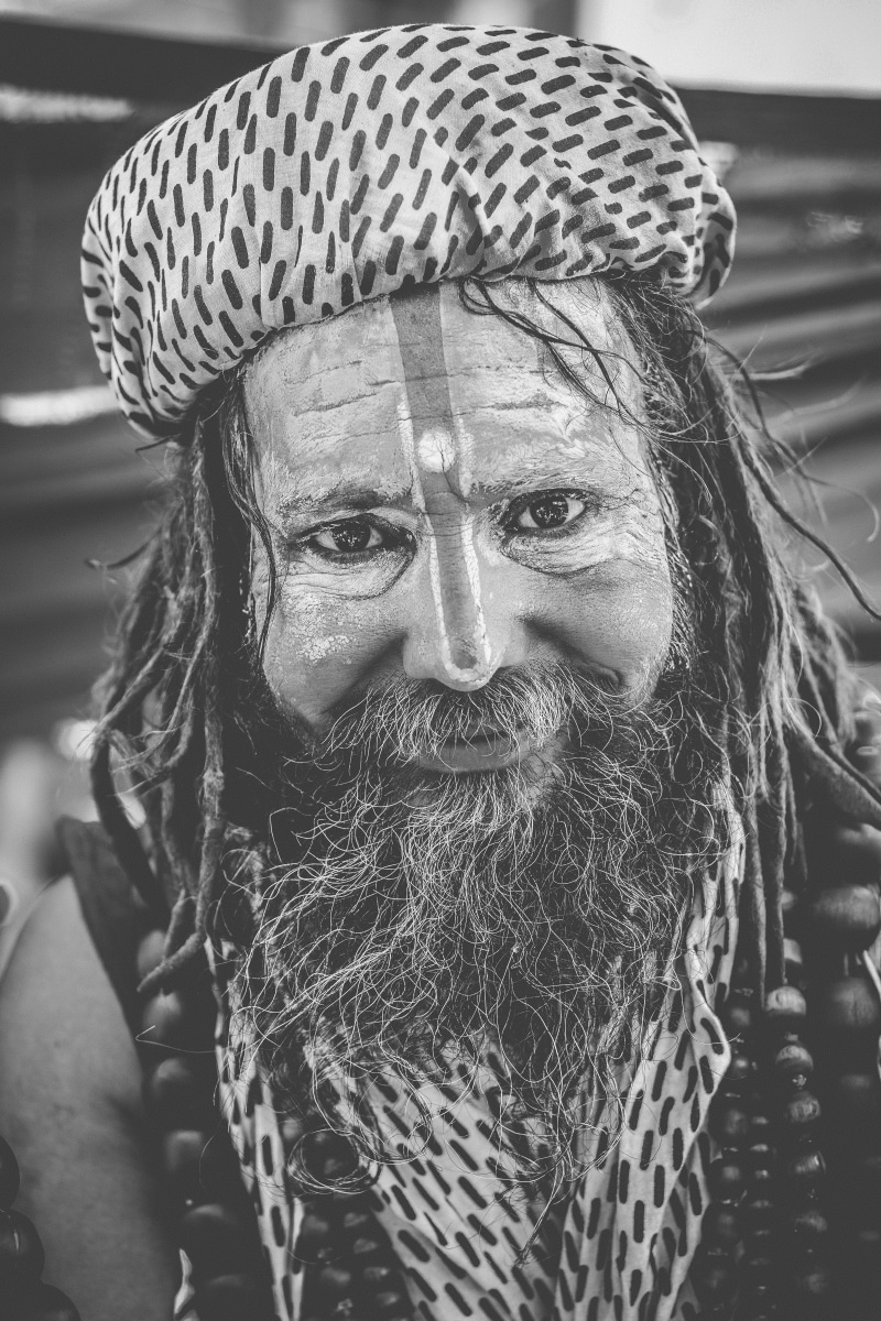 lifestyles, looking at camera, focus on foreground, hat, portrait, adult, indium, facial hair, spiritual, clothing, karma, selfie, culture, leisure activity