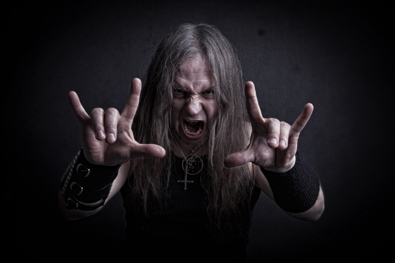 ILY sign, horror, roar, studio shot, metal band, aggression, black background, rock, emotion, guitarist, 5K, rock bands, human body part, front view, musician