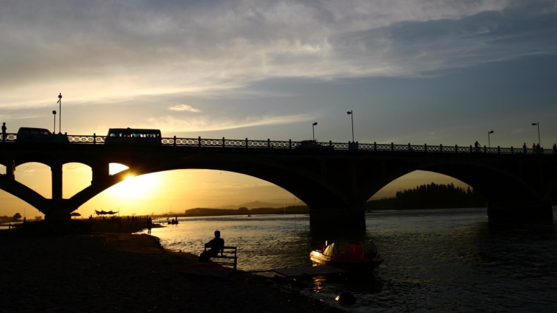 men, connection, arch bridge, built structure, river, transportation, sunset, architecture, china, real people, arch, sky, 1080P, gulja, bridge - man made structure