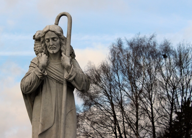 carrying, male likeness, sculpture, religion, craft, bear, tree, day, the good shepherd, no people, famous Place, cane, man, statue, plant, nature, human representation
