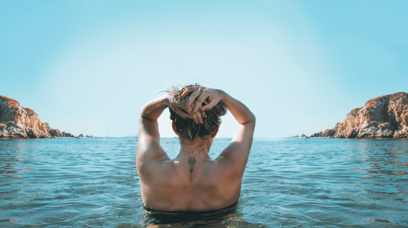 solid, trip, travel, daylight, one person, holding, water, hot, beauty in nature, adult, outdoors, beach, islands, holiday, wet, ocean, rock, body, young adult