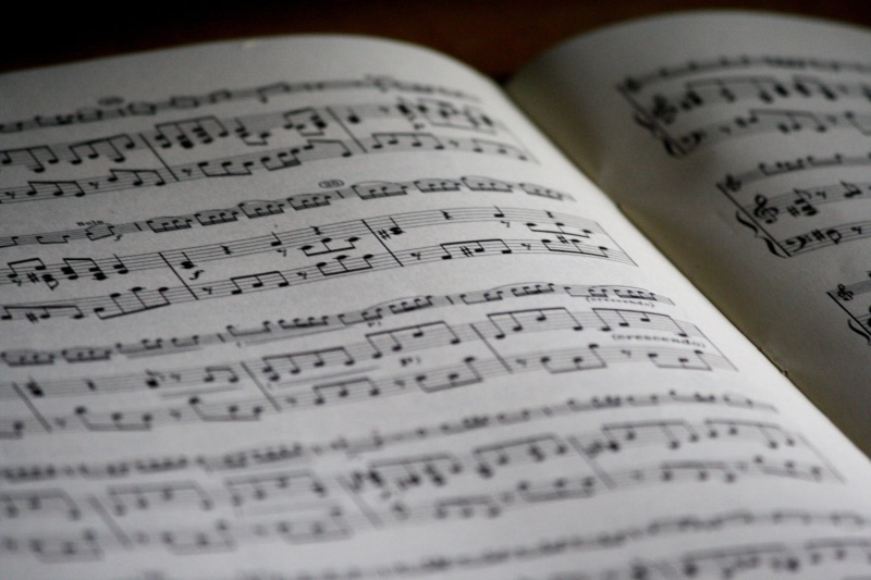 high angle view, book, melody, ranges, musical Note, publication, arts culture and entertainment, close-up, paper, shadows, black and white, still life