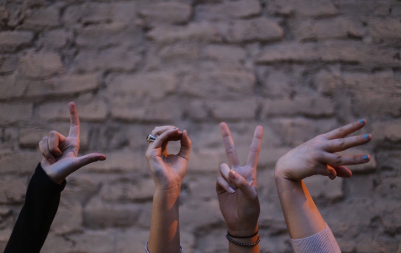 human finger, people, fingers, gestures, love, arms raised, group of people, human limb, finger, human hand, human arm, real people, togetherness, focus on foreground