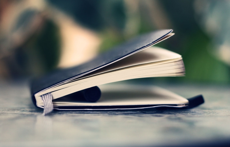 still life, sunlight, stack, education, reading, writing, business, book, notebook, outdoors, wood - material, focus on foreground, backgrounds, document