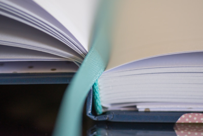 green, agenda, page, no people, bookmark, motion, notebook, pencil, read, pen, white, outdoors, learning, pages, planning, selective focus, day, rope, cable