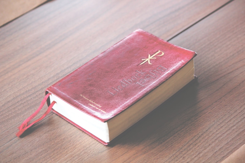pages, emotion, table, religion, single object, verses, education, furniture, book, 5K, indoors, wood - material, paper, wood, testament, positive emotion
