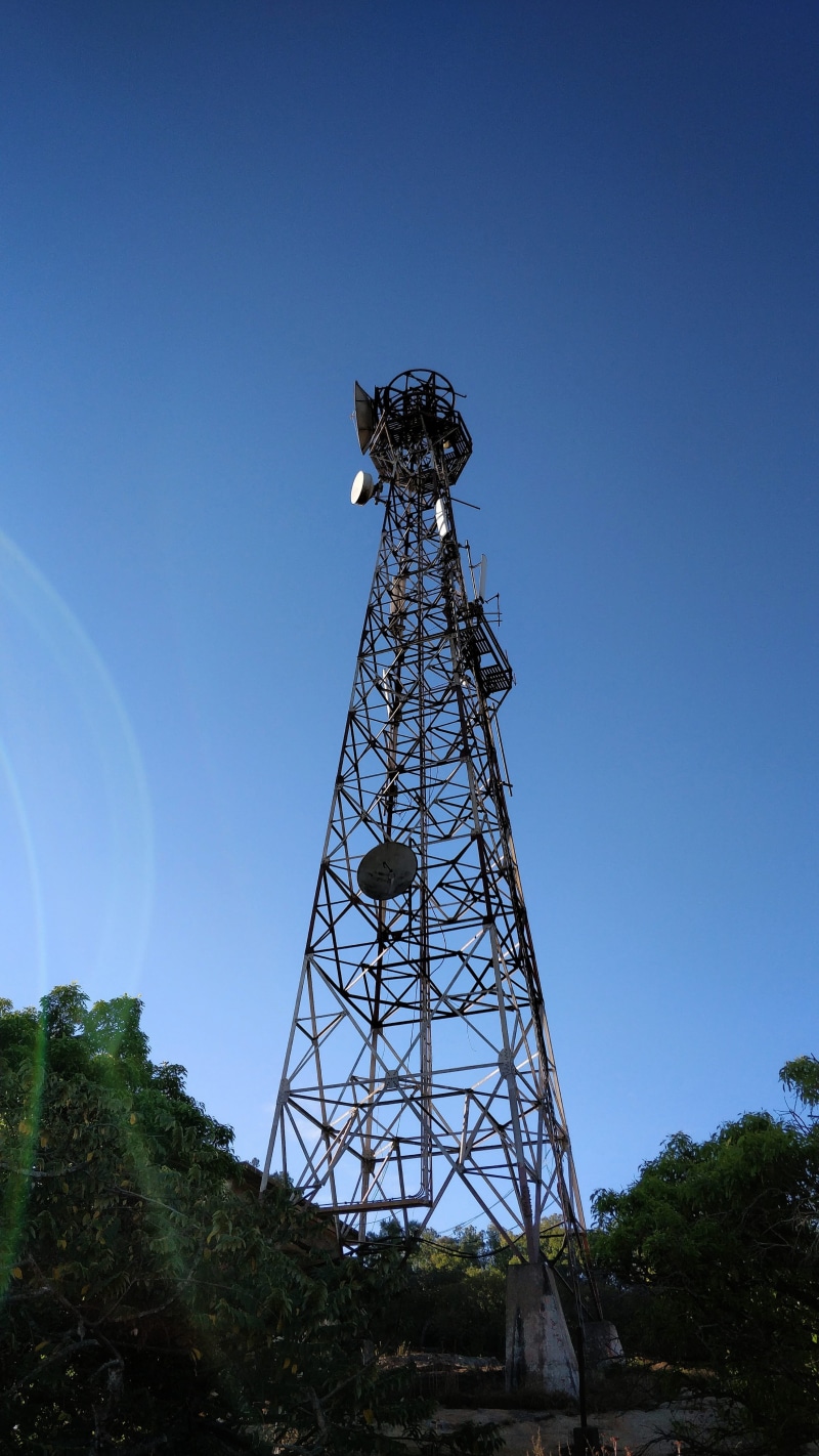 tower, broadcasting, tree, 4K, tall - high, nandi hills, connection, blue, sky, low angle view, architecture, metal, outdoors, antenna, technology, smartphone photography