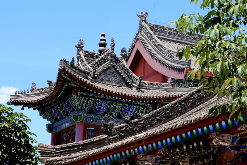 outdoors, china, day, belief, no people, roof, sky, moxie, documentary, clear sky, low angle view, iskcon temple, place of worship, building, nature, blue