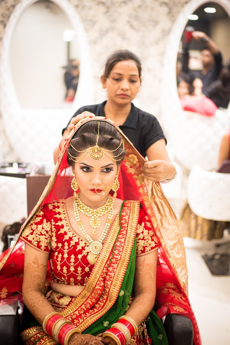 4K, style, photoshoot, outfit, polo, sitting, fixing, looking at camera, focus on foreground, females, pose, black, veil, three quarter length, beautiful woman