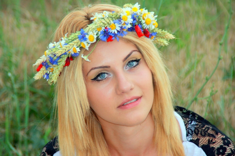 flower, looking at camera, flowering plant, beauty, headshot, adult, long hair, young women, portrait, nice, front view, hair, body part, beautiful people