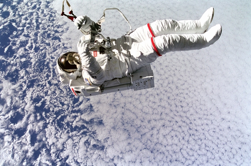 white color, high angle view, outdoors, international space station, mode of transportation, cold temperature, snow, warm clothing, sport, spacewalk, one person