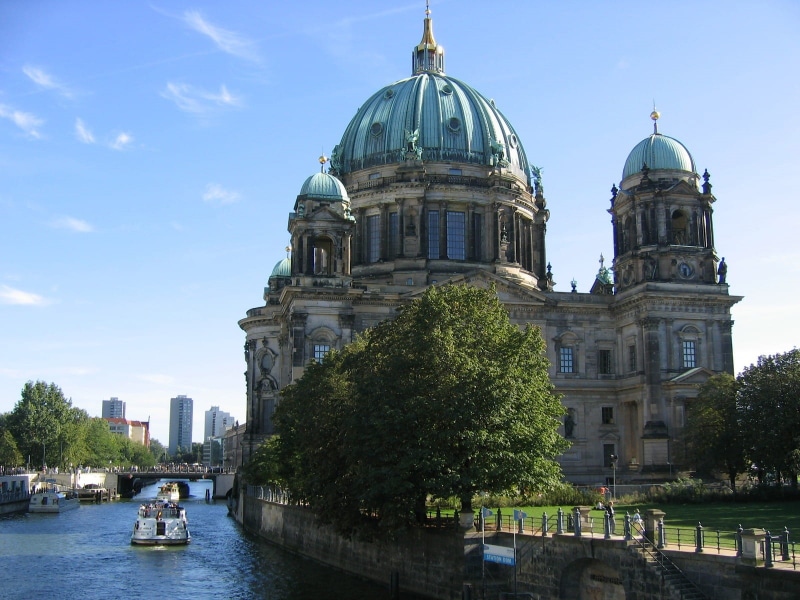 building exterior, boats, tree, belief, transportation, cathedral, summer, spirituality, city, people, landmark, outside, buildings, outdoors, trees, destinations
