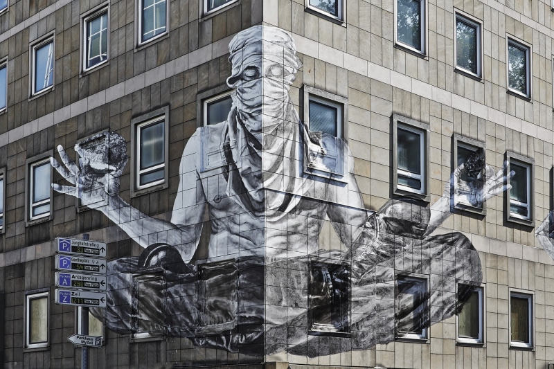 graffiti, built structure, city, meditation, representation, human representation, no people, building, outdoors, low angle view, street, day, building exterior