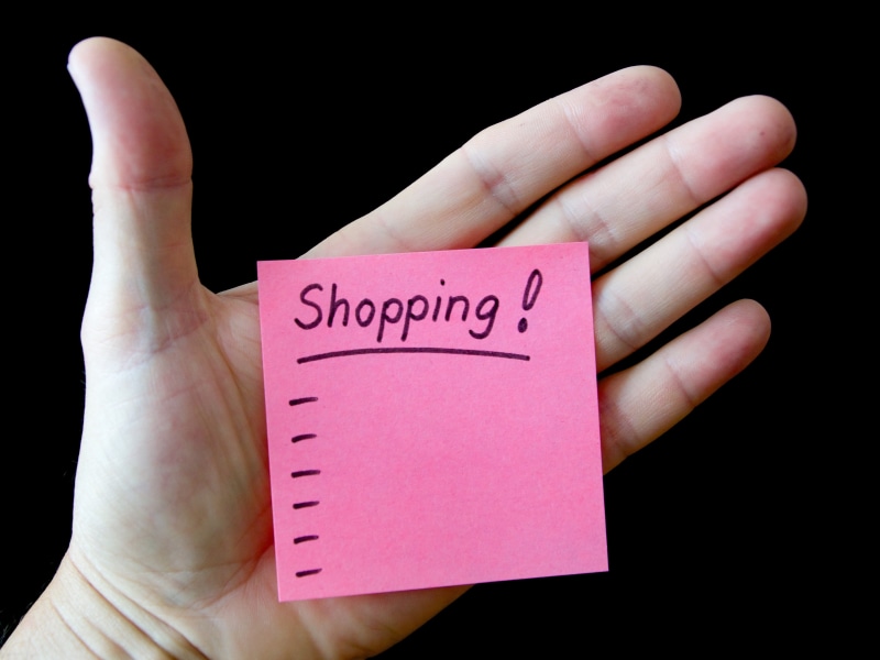 body part, human body part, hand, western script, black background, real people, indoors, holding, shopping, person, one person, communication, lifestyles