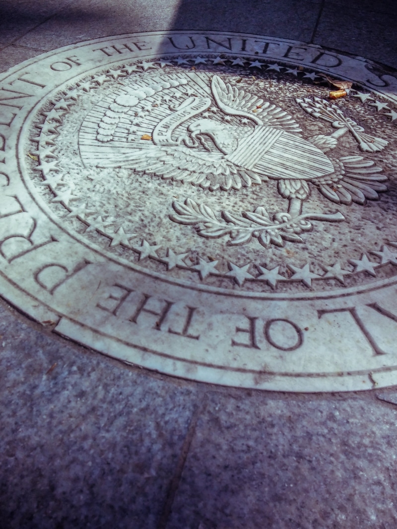 communication, carving, high angle view, indoors, us embassy, manhole, pattern, american, eagle, representation, business, architecture, art and craft