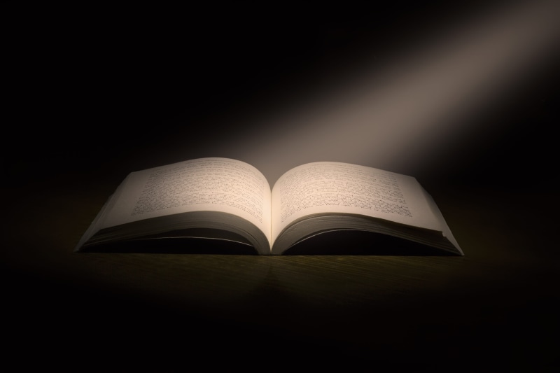 publication, studio shot, studying, single object, hardcover book, open, enlightenment, opened, 5K, dark, learning, sun ray, indoors, expertise, paper