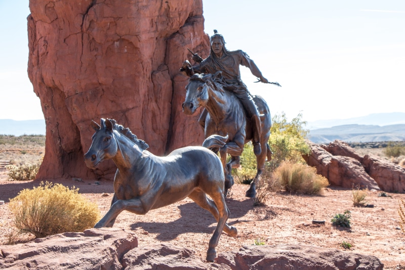 riding, statue, landmark, herbivorous, day, travel, culture, sculpture, animal, wild, sky, domestic animals, horse, land, west, riding horse, indian, rock
