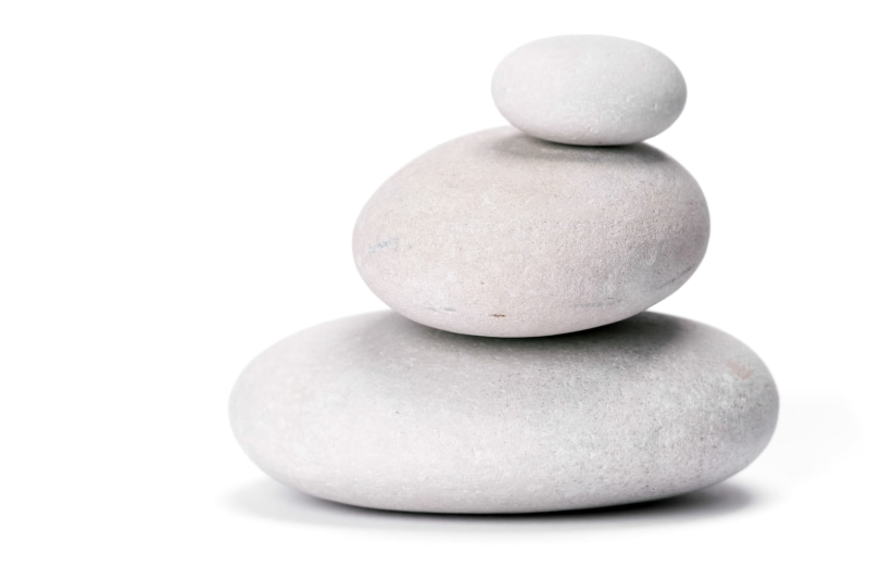 zen, focus on foreground, indoors, cobblestone, gray, symbols, white color, rock - object, meditating, balance, nature, spa, stationary, white background