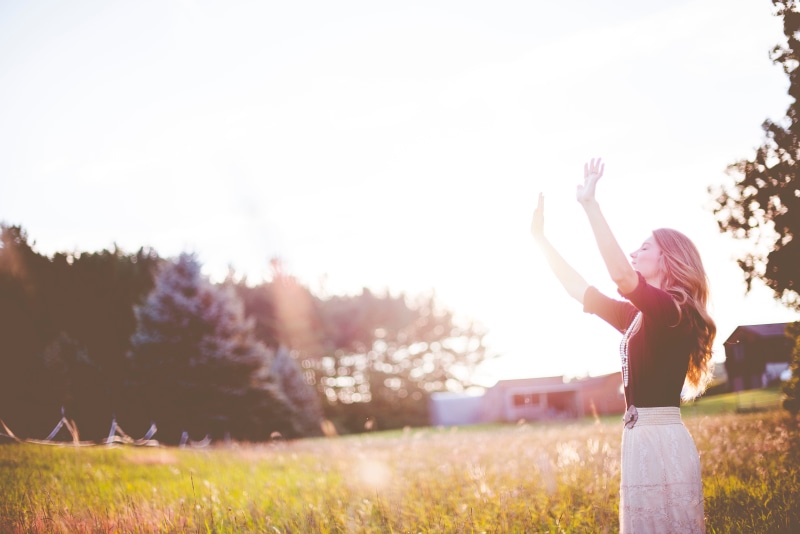 black, field, worship, grass, real people, hands, land, people, plant, girl, leisure activity, hairstyle, only women, lens flare, human arm, bokeh, raising