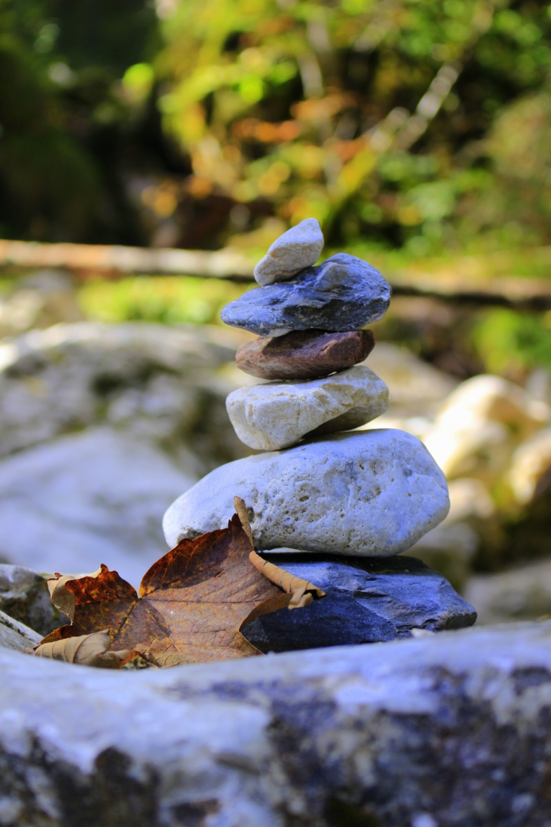 rock - object, wellness, silent, relaxation, beauty in nature, relax, feng shui, day, tranquility, landscape, harmony, land, stone - object, close-up, focus on foreground