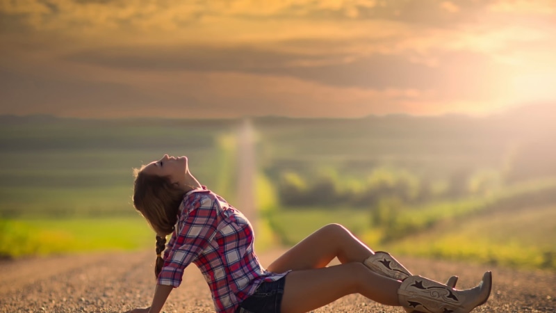 Nebraska, boots, Jake Olson, jean shorts, young women, one person, real people, hairstyle, relaxation, plaid, sitting, nature, beauty in nature, casual clothing