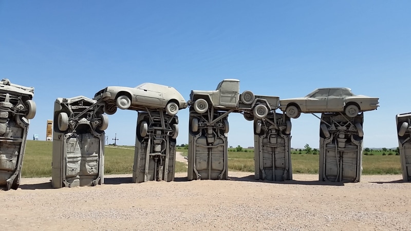clear sky, tourism, sunlight, architecture, travel destinations, history, nebraska, carhenge, no people, built structure, sculpture, blue, copy space, day
