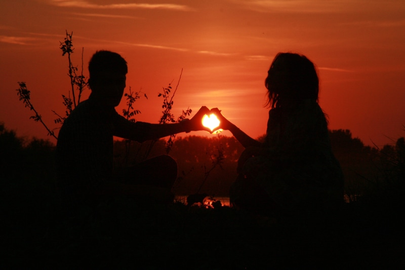 burning, men, leisure activity, people, togetherness, sun, two people, couple, women, silhouette, outdoors, sunset, real people, bonding, water, making