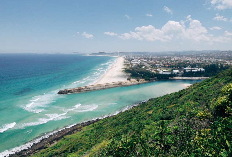 beach, building exterior, motion, ocean view lookout track, sky, outdoors, ocean, sea, city, shoreline, transportation, peninsula, promontory, scenics - nature