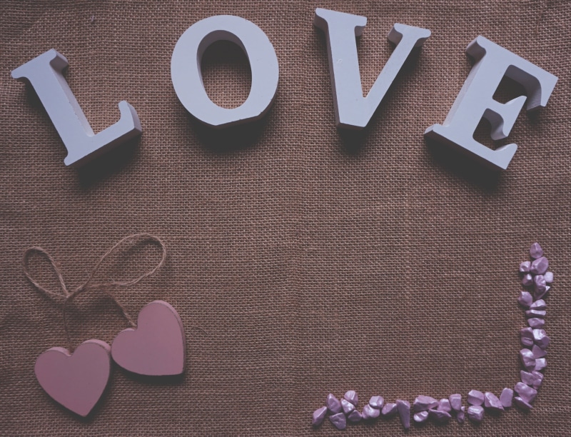 brown, close-up, four, creativity, gray, western script, pink, plant, still life, positive emotion, high angle view, hearts, cutout, heart shape, stones