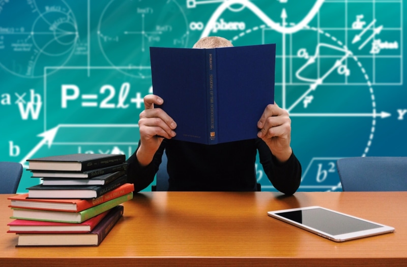 activity, learning, learn, student, students, males, read, child, occupation, textbook, desk, holding, book, blackboard, study, school, table, men, reading