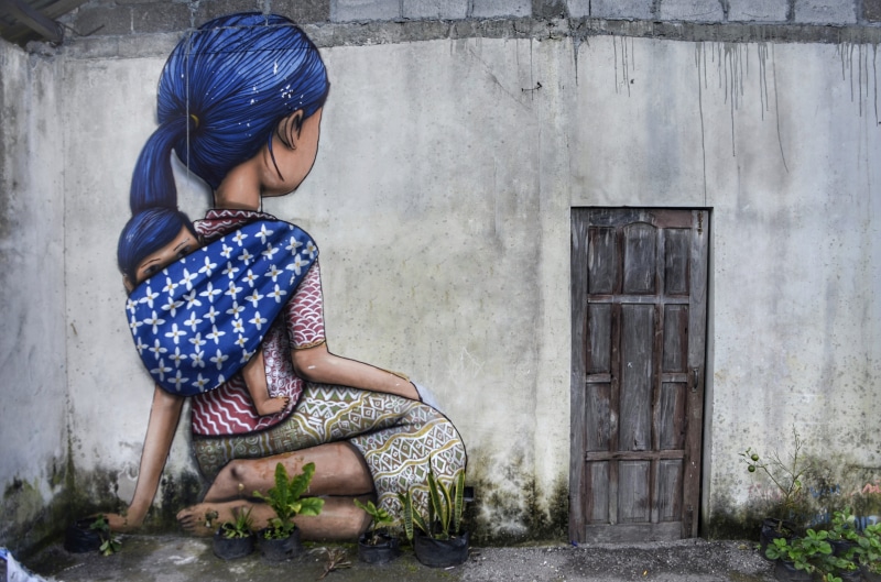 social issues, hopelessness, outdoors, entrance, street, painting, girl, child, kneeling, one person, house, females, wall, clothing, day, real people