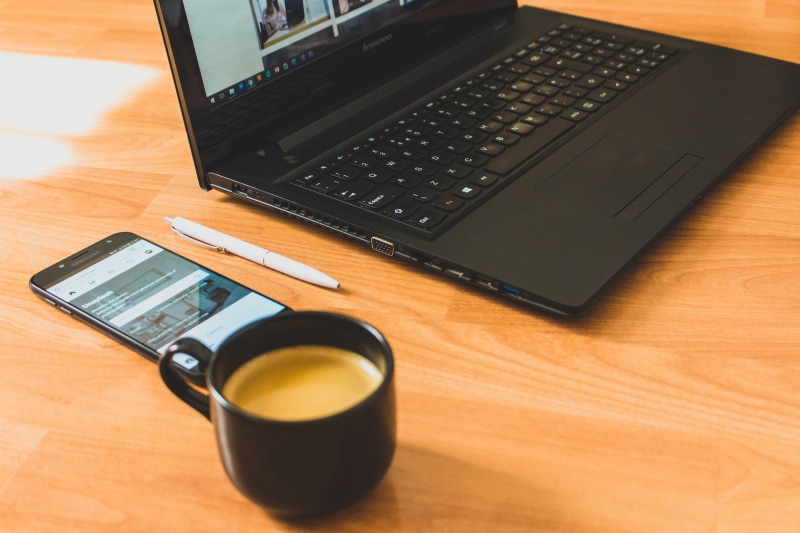 no people, high angle view, notebook, phone, pen, table, communication, mug, 5K, office, wireless technology, computer equipment, indoors, keyboard, coffee