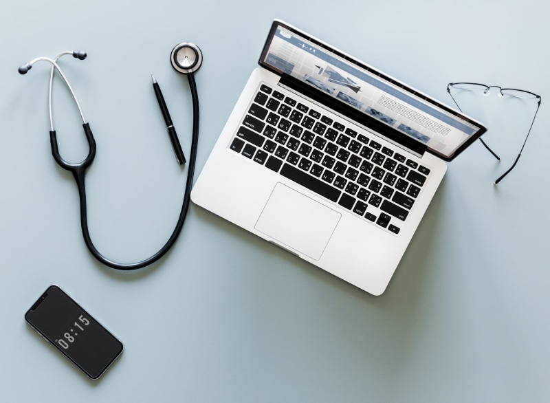indoors, no people, directly above, portable, flatlay, computer equipment, silver colored, sunglasses, smartphone, wireless, laptop, text, studio shot