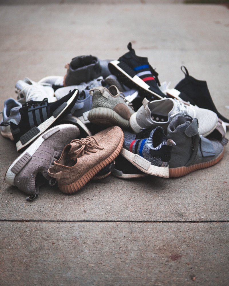 trainer, fashion, flooring, boost, footwear, shoe, no people, clothing, yeezy, tiled floor, surface, nmd, still life, style, choice, sneaker, assorted