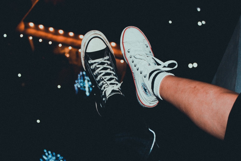 footwear, human leg, phanthiet, alloy wheel, wheel, human body part, high angle view, unrecognizable person, canvas shoe, apparel, low section, low, sneaker