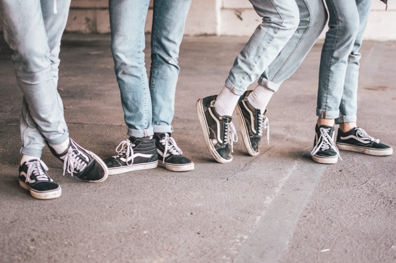 group of people, vans, city, adult, togetherness, white, human body part, day, standing, four, old, human limb, limb, black, fashion, human leg, body part