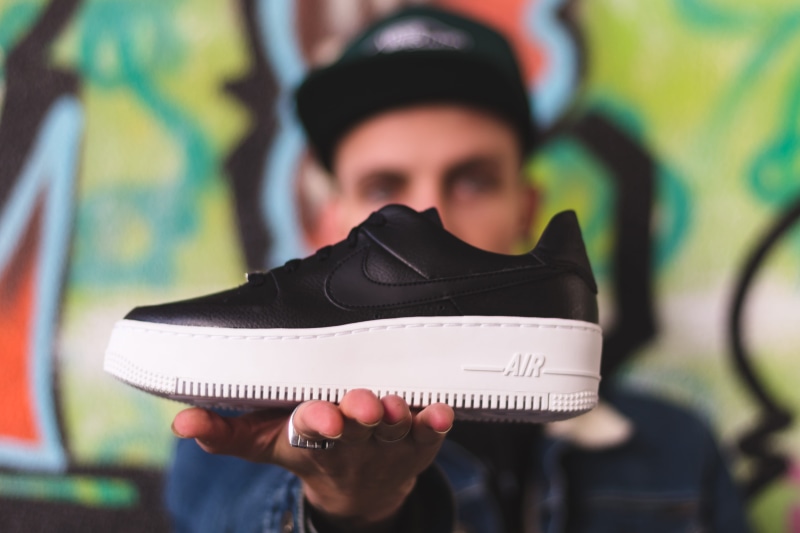 black, s, shallow, young women, air force 1, cap, forced, portrait, art and craft, sneaker, man, air, adult, casual clothing, holding, occupation, graffiti