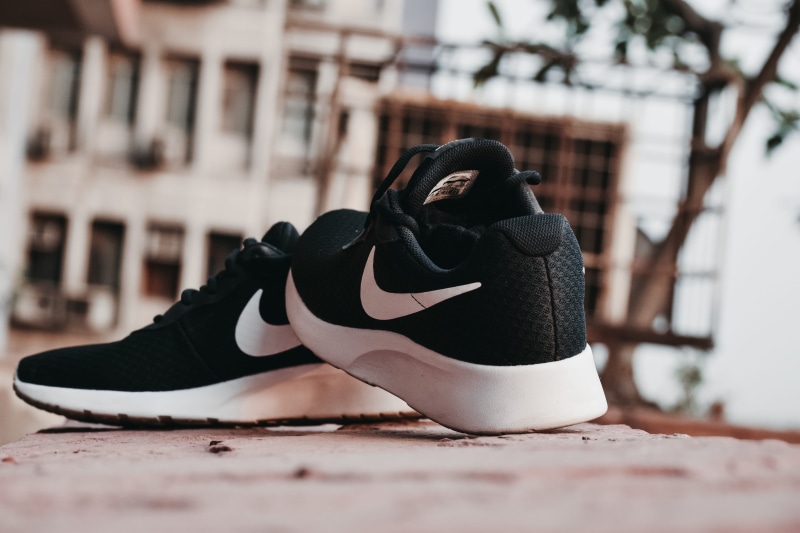 street, focus on foreground, sports shoes, 5K, white, brown, pair of shoes, colors, selective focus, black, footwear, close -up, architecture, lace - fastener