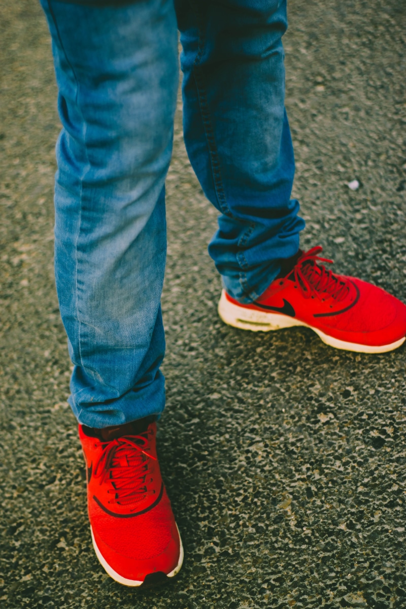 wearing, one person, style, street, day, running, sneakers, red, denim, person, 5K, legs, human limb, human leg, lifestyles, human body part, standing