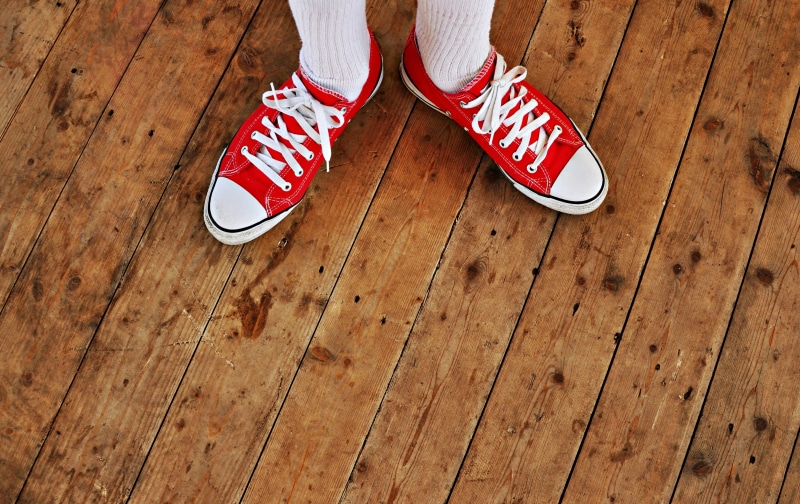 white socks, wooden floor, shoe foot, walking, sneakers, female, exercising, pair, shoelace, canvas Shoe, red, person, leisure footwear, indoors, hardwood floor