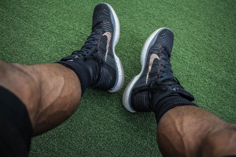 wearing, athlete, shoes, outdoors, foot, low section, people, fitness, men, green color, man, person, running shoe, leg, human limb, lifestyles, sport