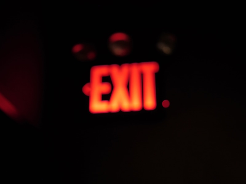 stop gesture, illuminated, night, word, western script, screen, electronics, light, social issues, indoors, communication, city, display, urban, red, human representation