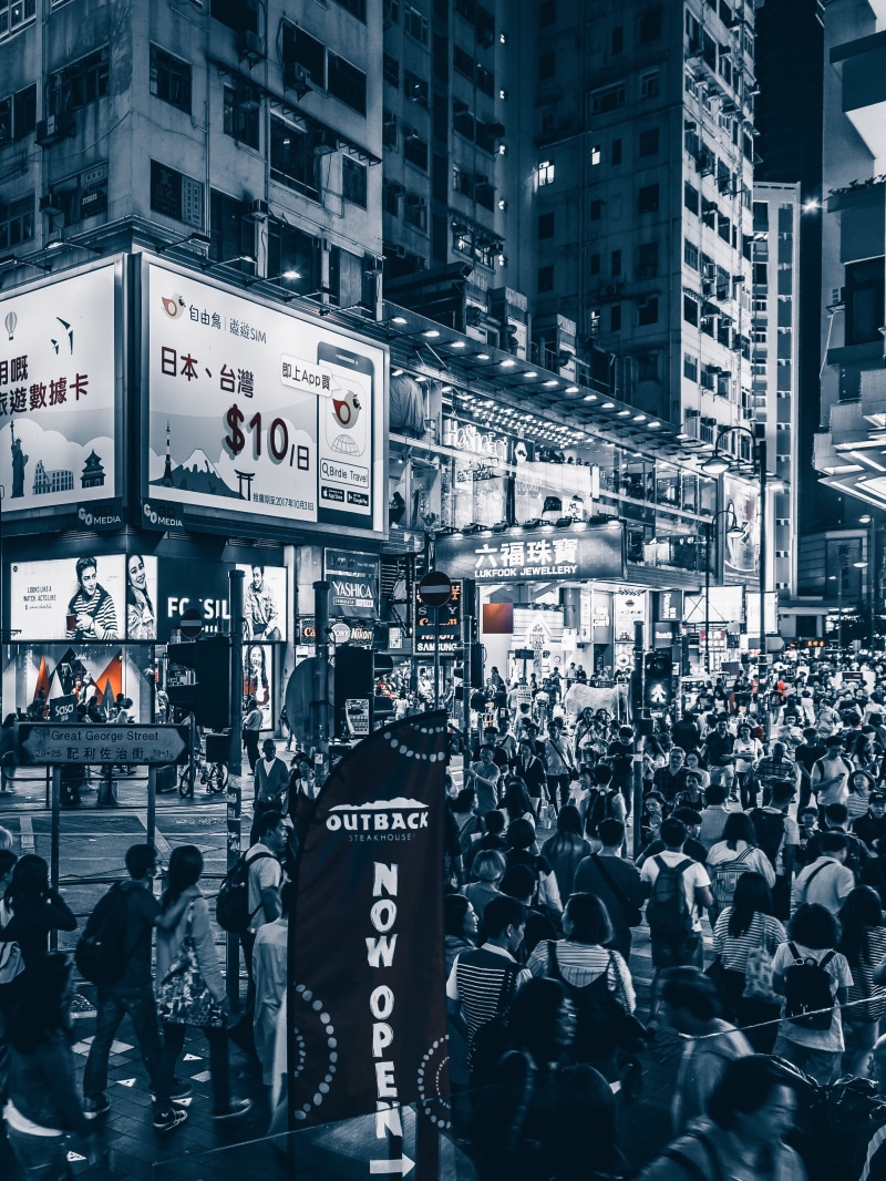 face, crowd, men, city, street, women, human, group of people, clothing, person, urban, building, pedestrian, advertisement, night life, apparel, architecture