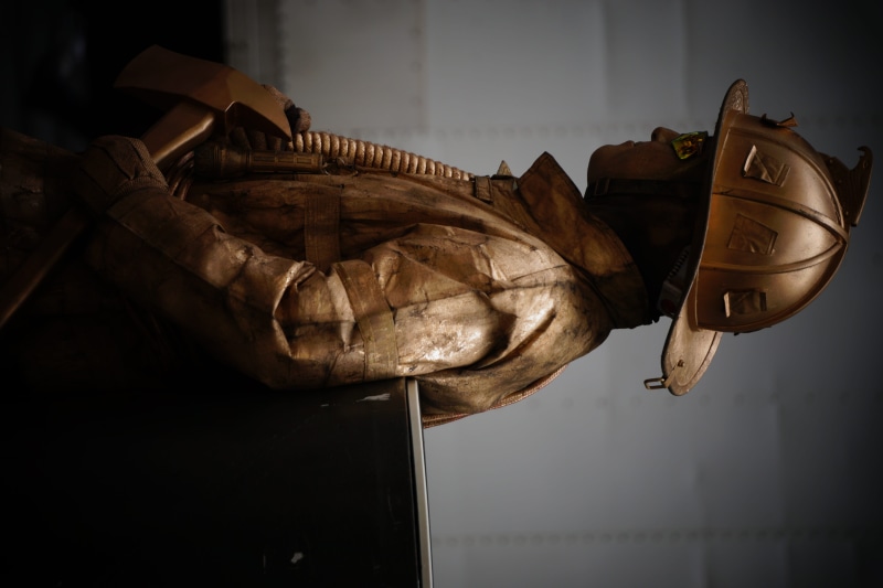 hanging, cowboy hat, statue, city, art and craft, metropolis, day, close-up, representation, creativity, hat, no people, human representation, focus on foreground