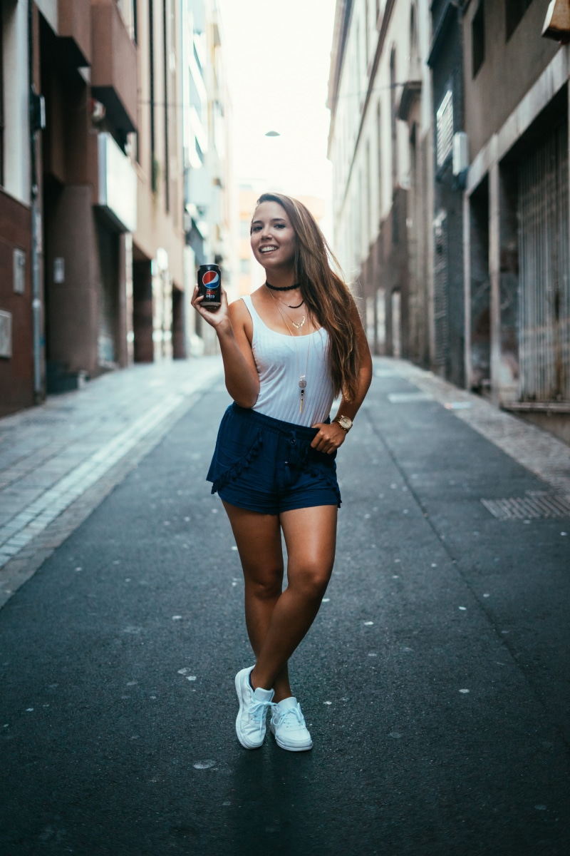 shorts, full length, road, can, building, asphalt, street, metropolis, electronics, leisure activity, built structure, real people, shoe, beauty, young women