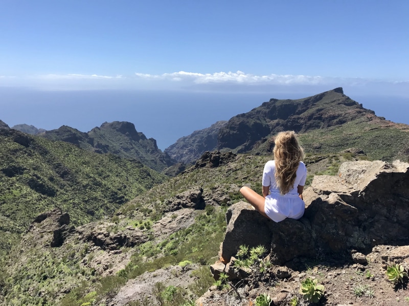 clouds, sky, mountain, woman, green, 4K, blue sky, mountains, women, non-urban scene, top, casual clothing, one person, tranquility, rock, nature, beauty in nature