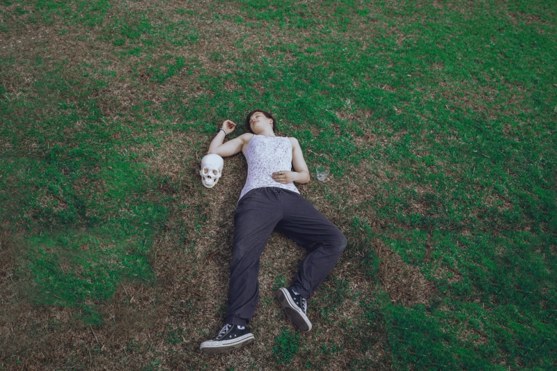 sphere, pills, lying, football, young men, real people, ball, contemplation, sports, casual clothing, laying down, front view, full length, men, day, people