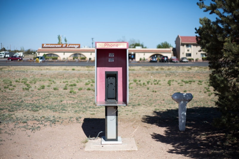 text, day, field, communication, no people, sign, western script, phone, obsolete, land, telephone, outdoors, sky, built structure, broken, telephone booth